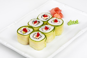 Sushi roll with avocado, cucumber and caviar.