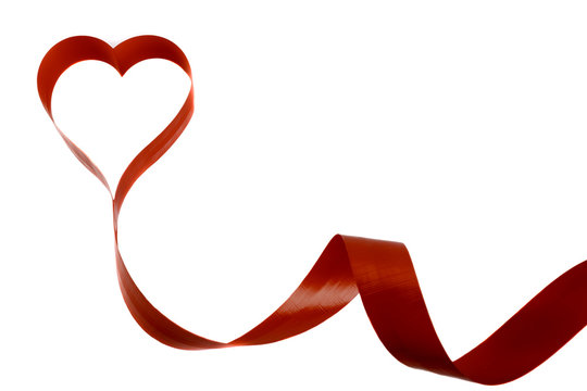Red tape on a white background in the form of heart
