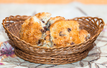Hand-made sand oat cookies in wicker basket on decorated napkin