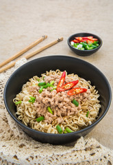 Instant noodles with pork in bowl