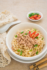 Instant noodles with pork in bowl