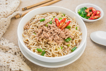 Instant noodles with pork in bowl