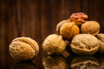 Walnuts on old wooden background