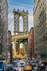 Manhattan Bridge at the end of a Narrow Street