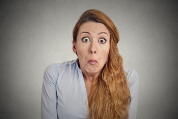 Funny woman has no Idea isolated on grey wall background 