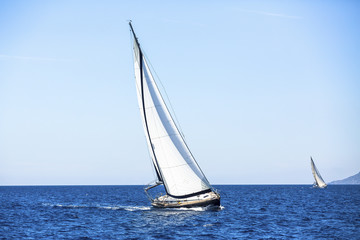 Sailing in the wind through the waves at the Aegean Sea.