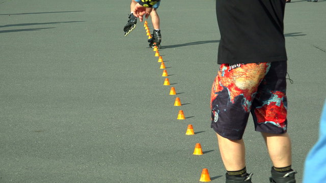 Skating on roller skates between cones. The snake. 4K.