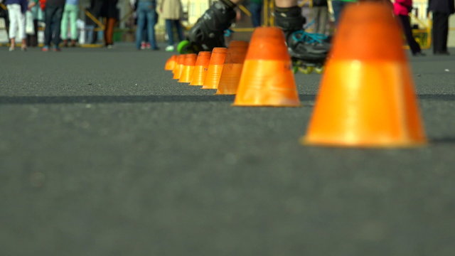 Skating on roller skates between cones. The snake. 4K.
