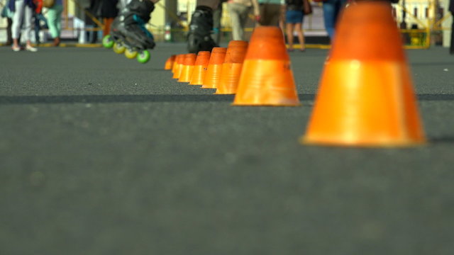 Skating on roller skates between cones. The snake. 4K.