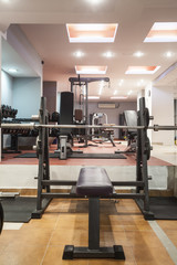 Fototapeta na wymiar Modern gym interior with equipment