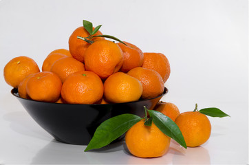 Clementines in black bowl
