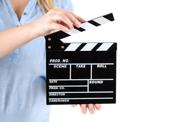 Womans hands holding a clapboard. Isolated on white
