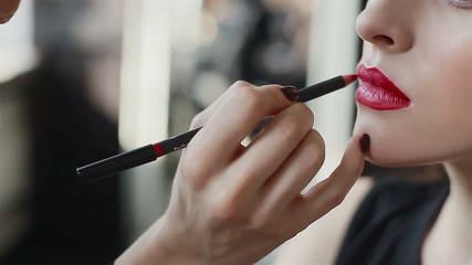 Lipstick on red lips of fashion model