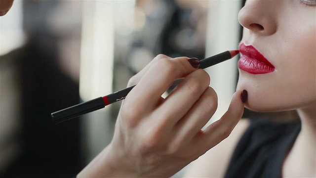 Lipstick on red lips of fashion model