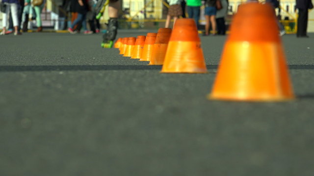Skating on roller skates between cones. The snake. 4K.