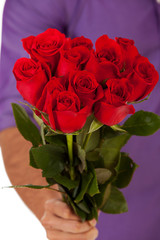 Valentine: Holding Out A Dozen Roses In Bouquet
