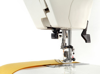 Sewing machine and fabric on a white background.