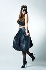 Young woman with party mask