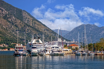 Fototapeta na wymiar Kotor bay with pier and boats in Perast, Montenegro.