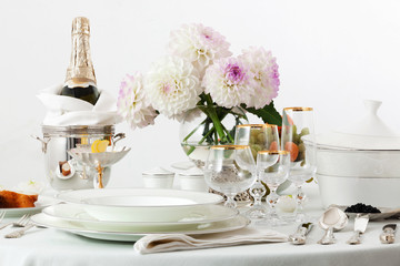 table with dishes and champagne