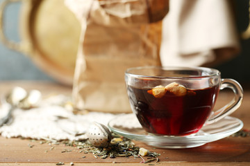 Beautiful vintage composition with herbal tea, on wooden table
