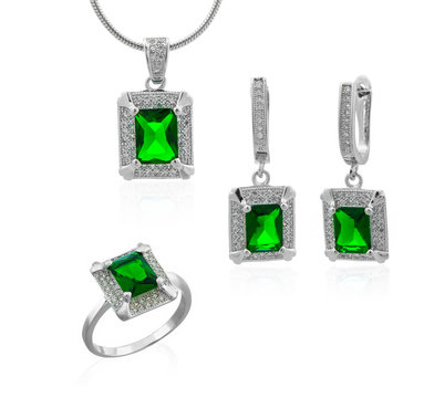 White gold beautiful set with emerald gems on a white background