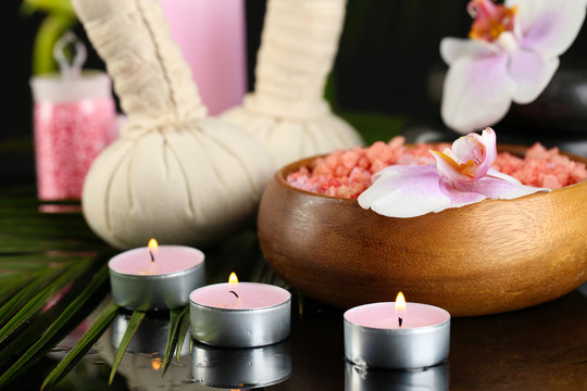 Beautiful spa composition with flowers on dark background