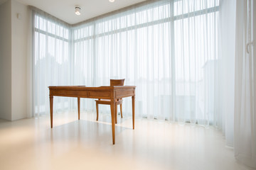 Vintage, wooden desk inside pure interior