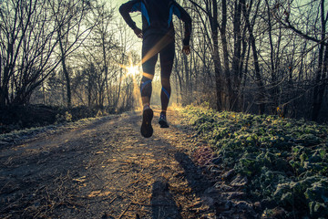 a man trail running in the country