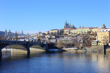 Snowy Prague gothic Castle above River Vltava, Czech Republic