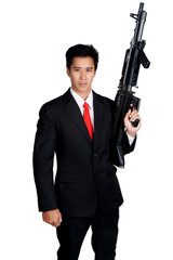business man holding machine gun