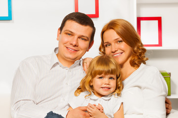 Obraz premium Full family portrait with girl mother and father