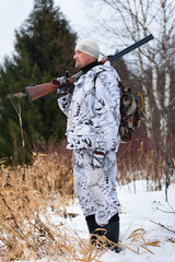 Fototapeta premium standing hunter with gun