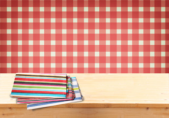 Rustic empty wooden table with tablecloth and retro background. 