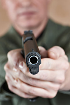 Soldier aiming a pistol Colt