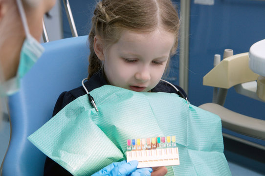 The Child Dental Picks Colored Fillings On Clinic