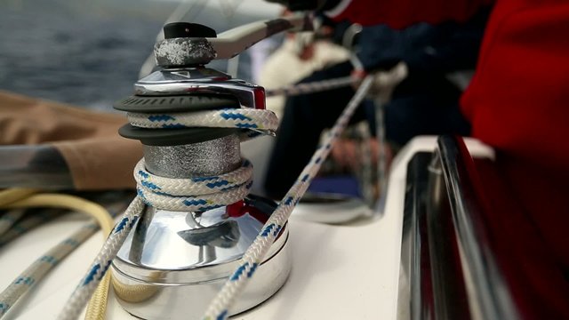 Ropes, winding sheets around winches. Sailing in the Sea.