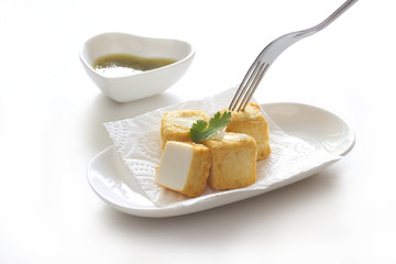 Tofu fish in white plate on white background