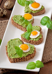 Sandwich with avocado paste and egg in the shape of heart