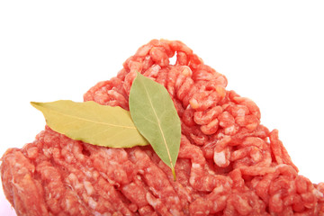 Raw pork meat ground beef with bay leaf on white background.