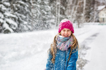 Little girl closed her eyes in Winter