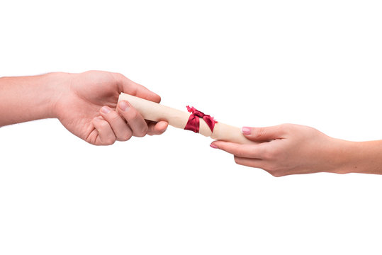 Hand Giving Rolled Parchment With Ribbon