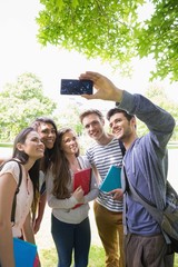 Fototapeta premium Happy students taking a selfie outside on campus
