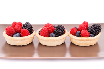 Fresh ripe berries in tartlets