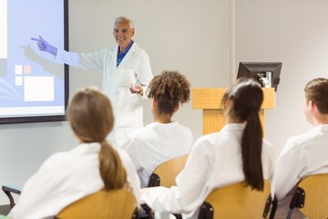 Science professor giving lecture to class