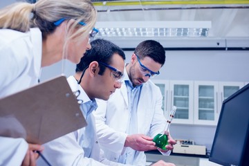 Fototapeta premium Science students working together in the lab