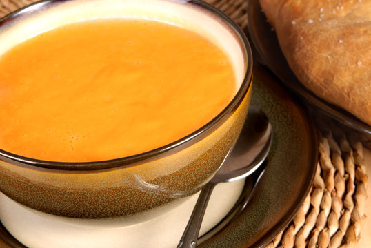 Pumpkin Soup In A Bowl Served With Focaccia Bread