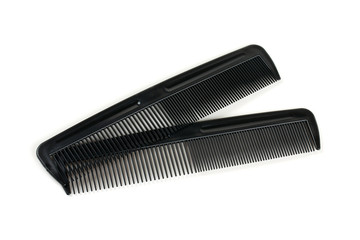 two black combs for hair isolated on white