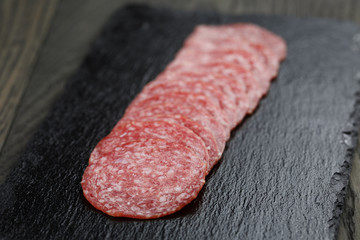 Salami slices slate board