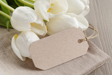 white tulips on rustic wood background